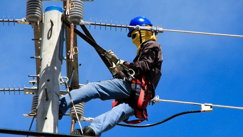 electrical tower worker practicing safety