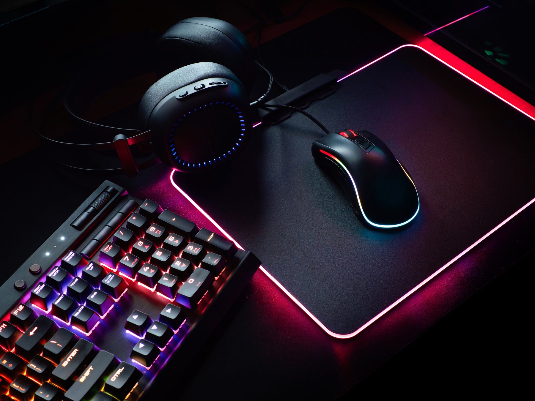 overhead view of gaming mouse, keyboard with RGB Color, joystick, headset, webcam, VR Headset