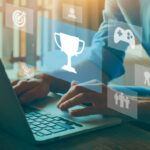 A person works at a computer on an elearning gamification program.