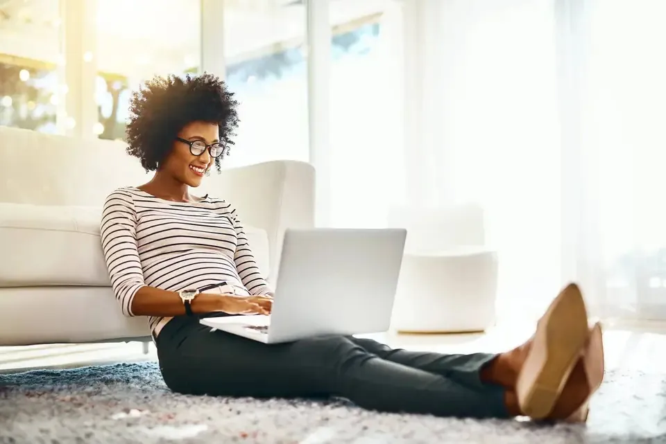 A woman browsing on a laptop